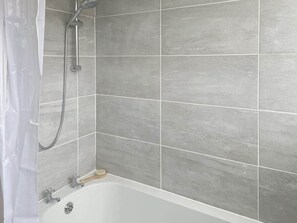 Shower, hair dryer, towels, toilet paper