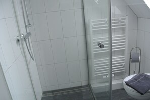 Shower, hair dryer, towels, toilet paper