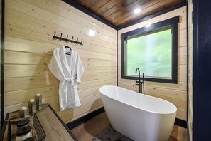 Bathtub, hair dryer, towels