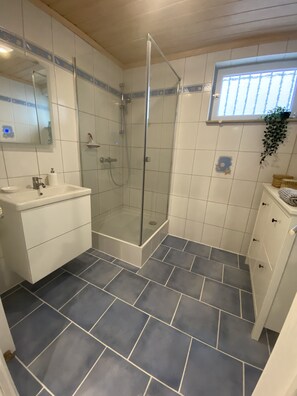 Shower, hair dryer, towels, soap