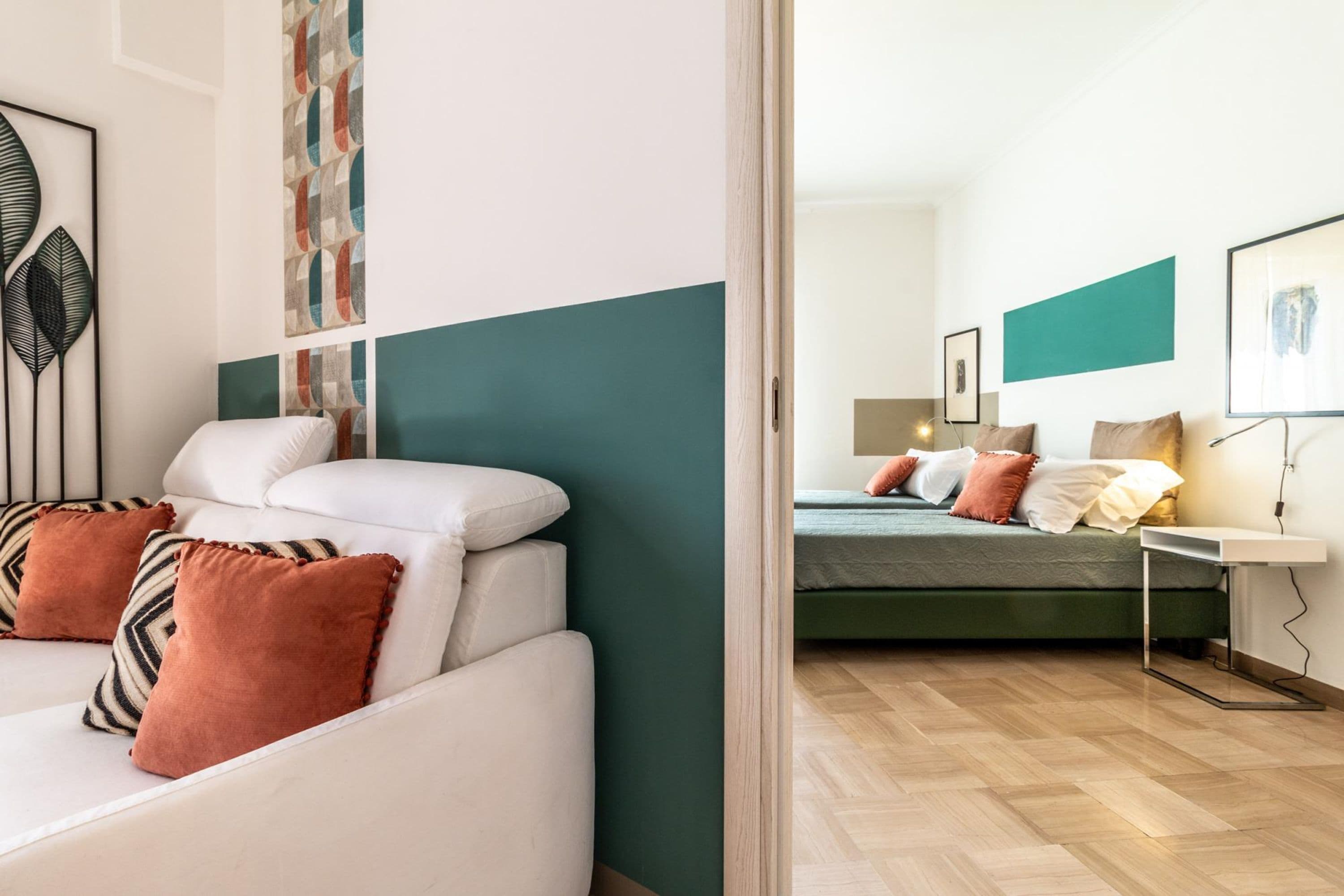 A modern bedroom with a bed, a bedside table, and a nightstand.