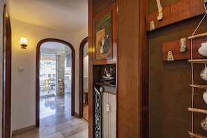 Stroll down the hallway to a cozy dining area with a table and chairs.