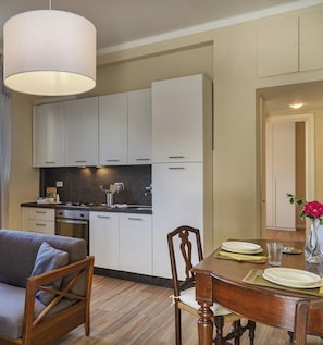 Enjoy meals in the well-equipped kitchen with a central island and dining area.