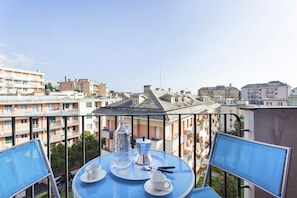 Enjoy a romantic meal for two on this balcony overlooking the city.