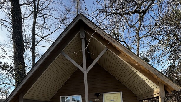 A small wooden cabin with a porch, a door, and a window. - Cozy cottage by the lake! 18c (Phenix City)