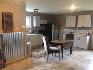 Fridge, coffee/tea maker, toaster, cookware/dishes/utensils