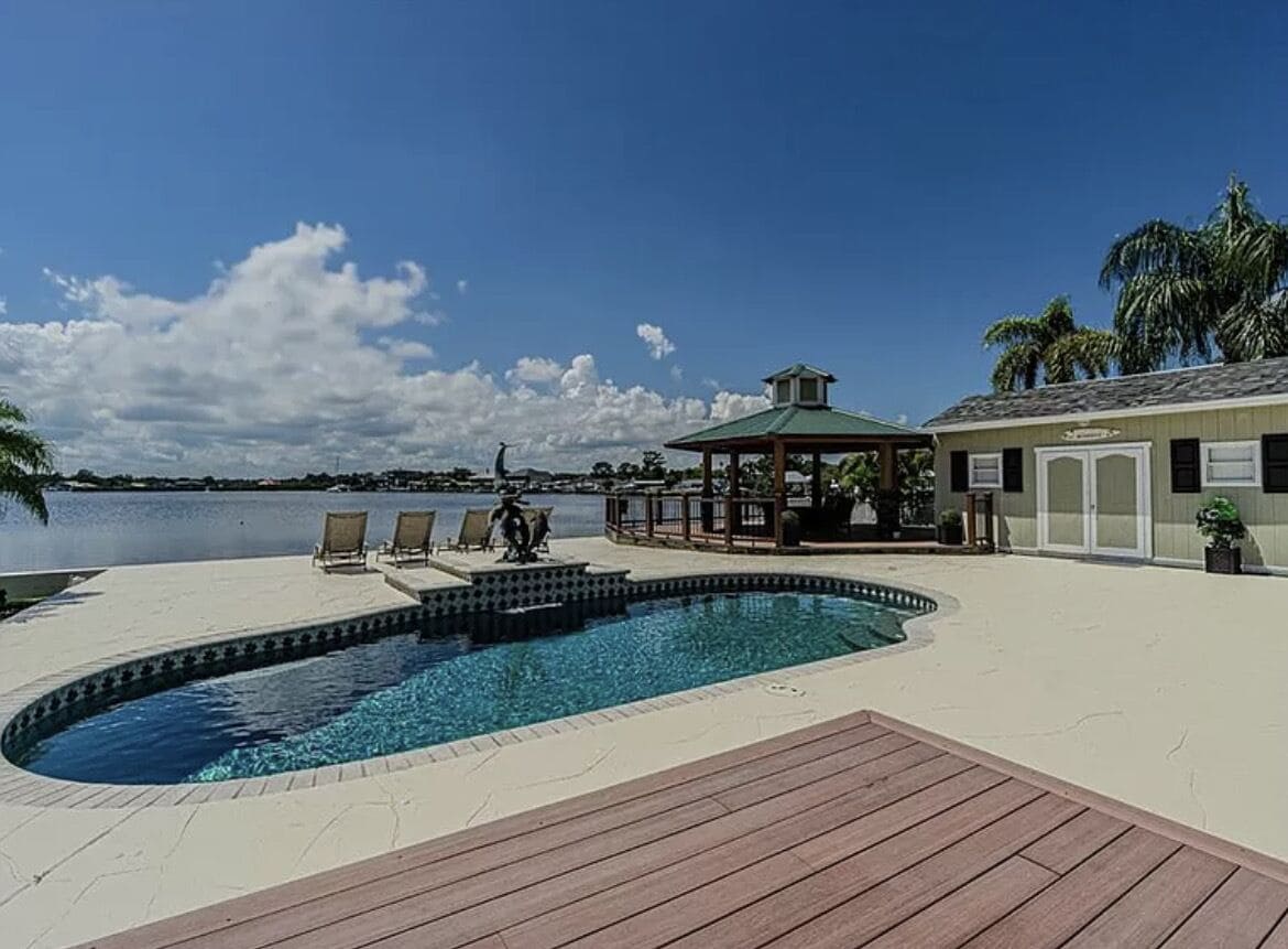 Waterfront Beach House with Pool, Fire Pit, Gazebo & Modern Tropical Renovation
