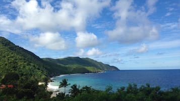 Beach nearby, white sand, beach towels