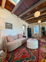 Michu Suite, 1 Queen Bed, Fireplace, Ground Floor | Living area | Fireplace, books