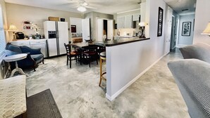 A compact living space with a kitchenette, dining area, and a small seating area. - Hideaway Haven @ Lake Granbury (Granbury)