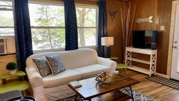 Premium Cottage | Living area | 32-inch TV with digital channels, DVD player