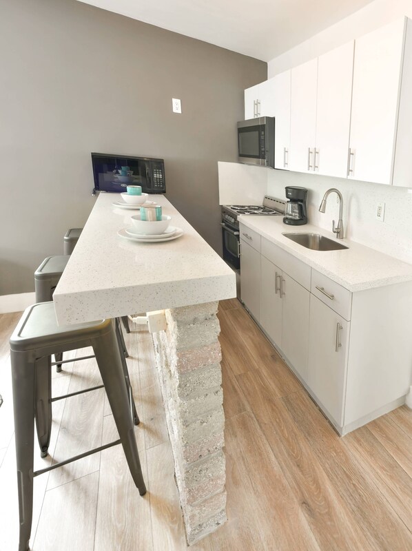 Fridge, microwave, stovetop, coffee/tea maker