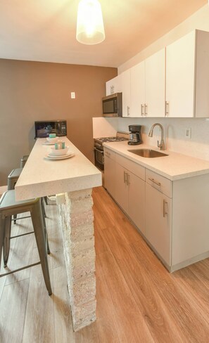 Fridge, microwave, stovetop, coffee/tea maker