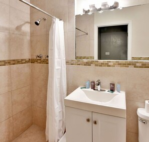 Shower, hair dryer, towels