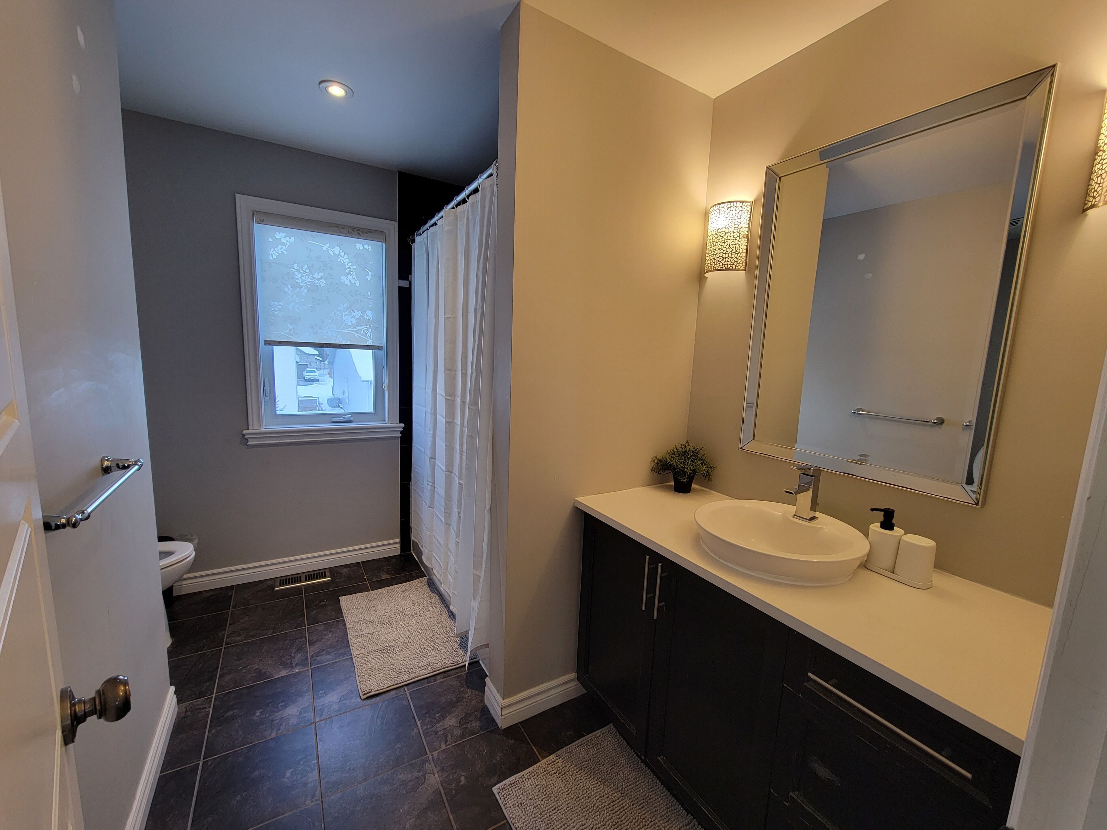 Combined shower/bathtub, hair dryer, towels, soap