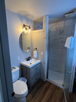 Shower, hair dryer, towels, soap
