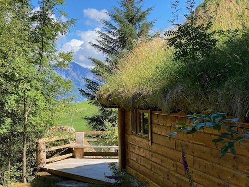 Wooden cabin with grass roof, sleeps 2-5 people., Self catering. Open fire place