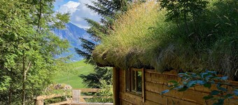 Wooden cabin with grass roof, sleeps 2-5 people., Self catering. Open fire place