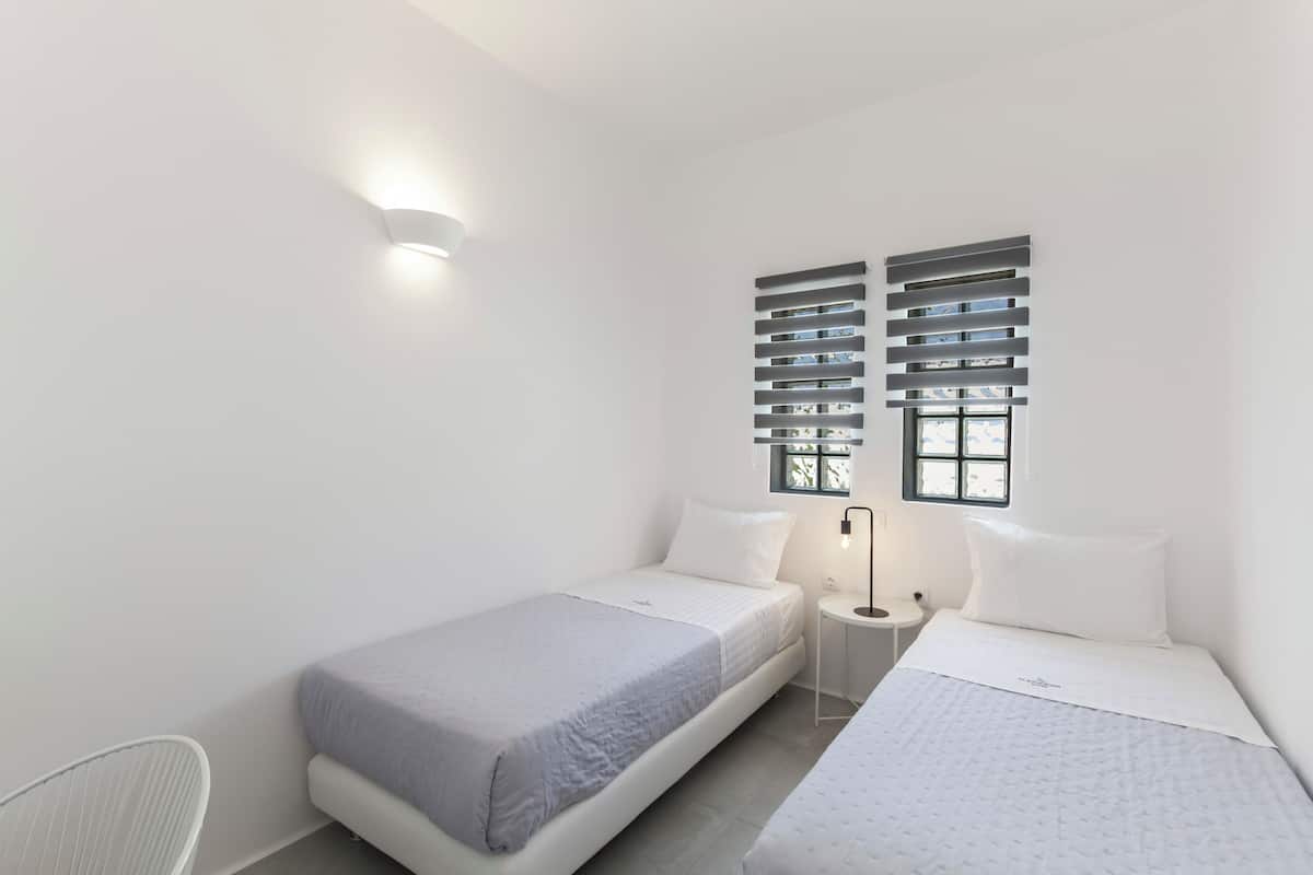 Premium bedding, memory-foam beds, in-room safe, laptop workspace