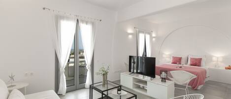 Suite Exclusive | Area soggiorno | Smart TV 43 pollici con canali satellitari, TV