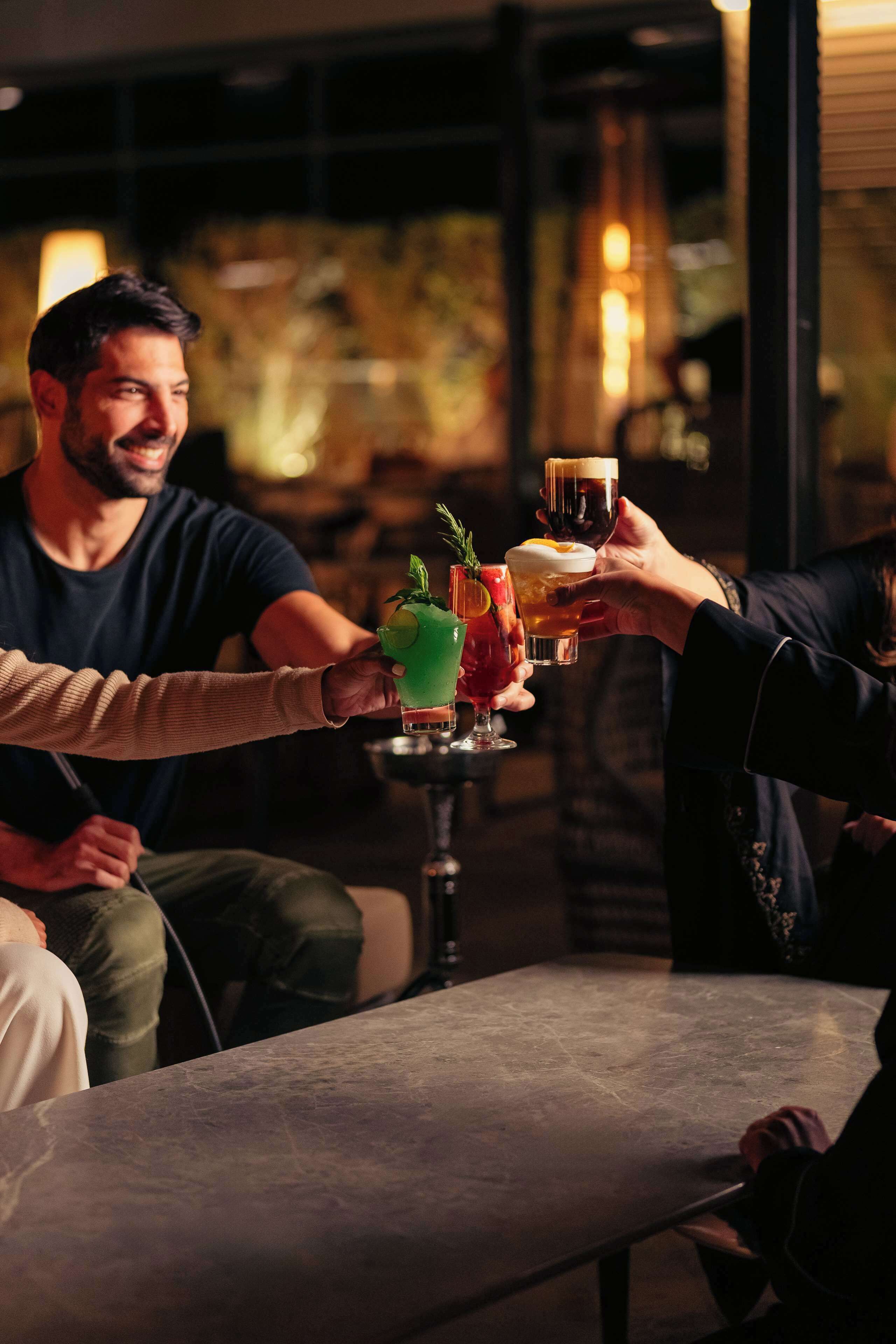 A bar setting with a table and drinks.