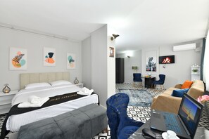 Suite estudio Confort | Ropa de cama hipoalergénica, minibar, escritorio
