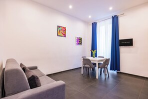 City Apartment | Living area | 43-inch Smart TV with digital channels, TV - Le Porte di Partenope (Naples)