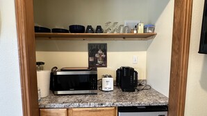 A compact kitchen with a microwave, toaster, and dishwasher. - The Lewis River Salmon Shores - Waterfront View & Fishing,  Book It Now! (Woodland)