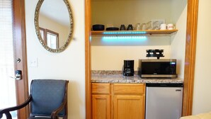 A compact kitchen with a microwave, coffee maker, and a dishwasher. - The Lewis River Salmon Shores - Waterfront View & Fishing,  Book It Now! (Woodland)