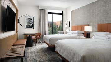 Premium bedding, down comforters, pillowtop beds, in-room safe