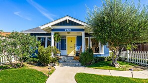 A single-story house with a front porch, number 258, and a well-maintained lawn. - House in Prime Belmont Heights Near Beach w/ Gym and Garage (Long Beach)