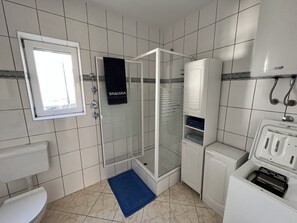 Shower, hair dryer, towels, soap