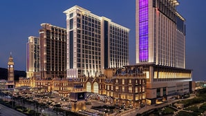 A high-rise hotel with a classic architectural style, featuring multiple floors and a prominent entrance with a grand facade. - The Londoner Hotel (Cotai)
