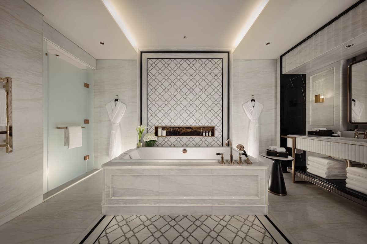 separate bathtub and shower, designer toiletries, hair dryer, bathrobes