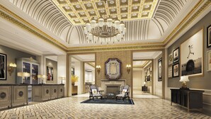 A grand lobby with a patterned floor, a large mirror, and a chandelier. - The Londoner Hotel (Cotai)