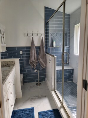 Shower, hair dryer, towels, soap