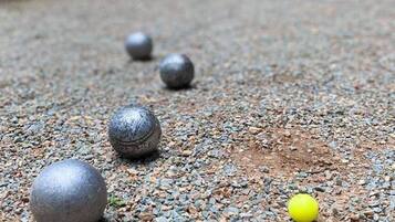 A gravel path with several spherical objects.