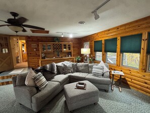 Flat-screen TV, fireplace, books