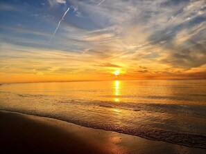 A beach scene with a sunset over the water. - Fall is in the air and the bay is calling! Book 3 nights, get 4th free! ♡Sunsets (Lower Township)