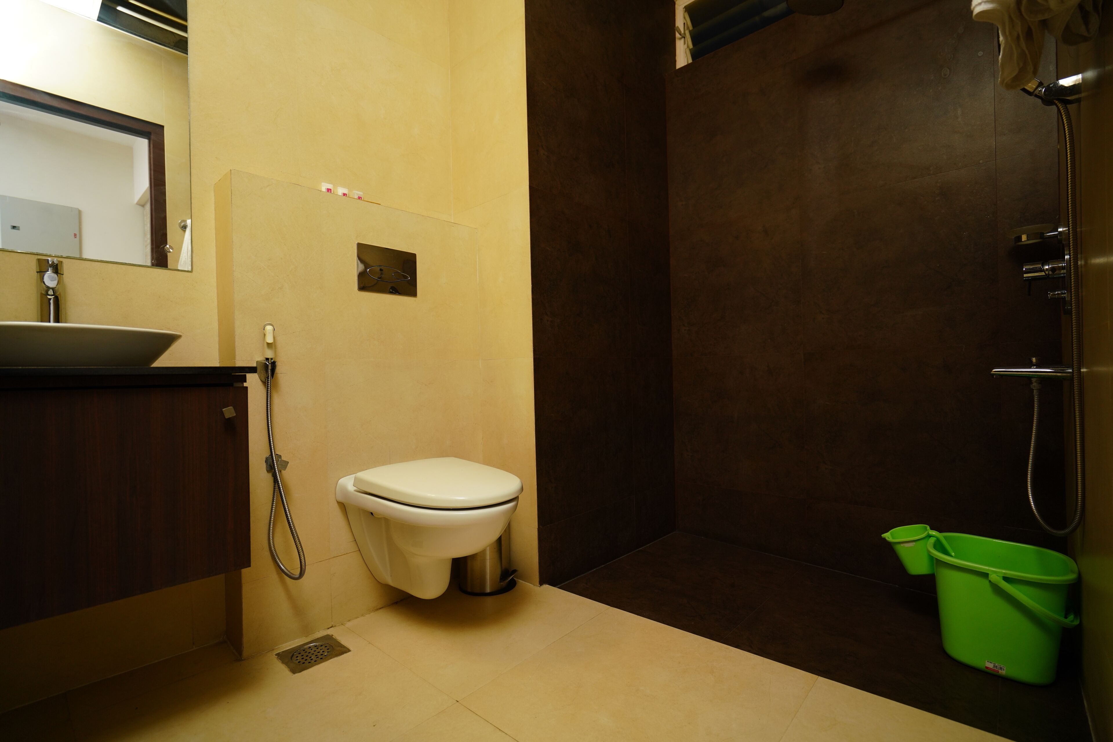 A bathroom with a sink, toilet, and shower.