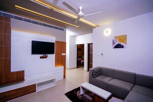 Two Bedroom Apartment | Living area | 40-inch Smart TV with digital channels