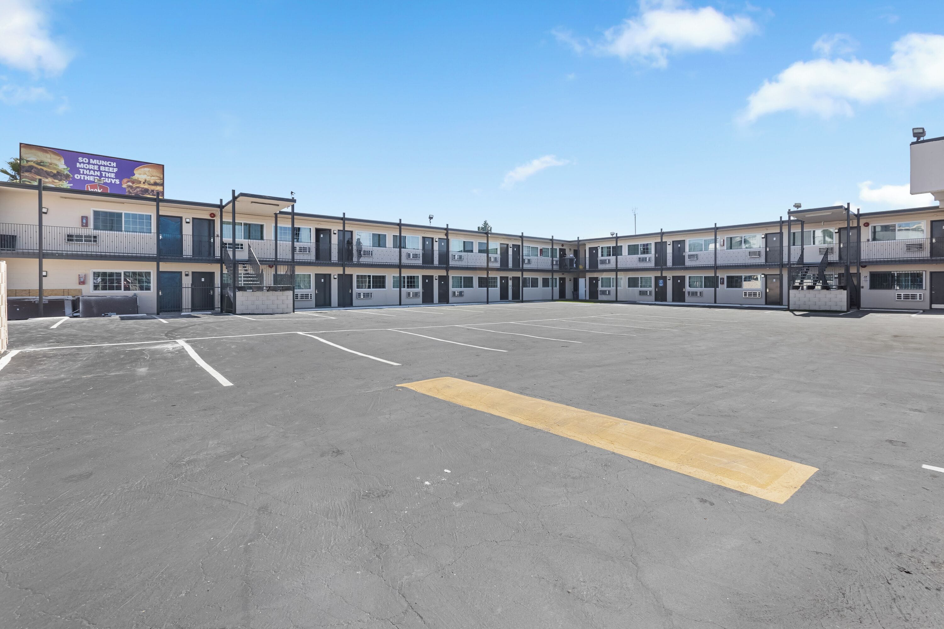 A multi-story parking garage with a clear sky.