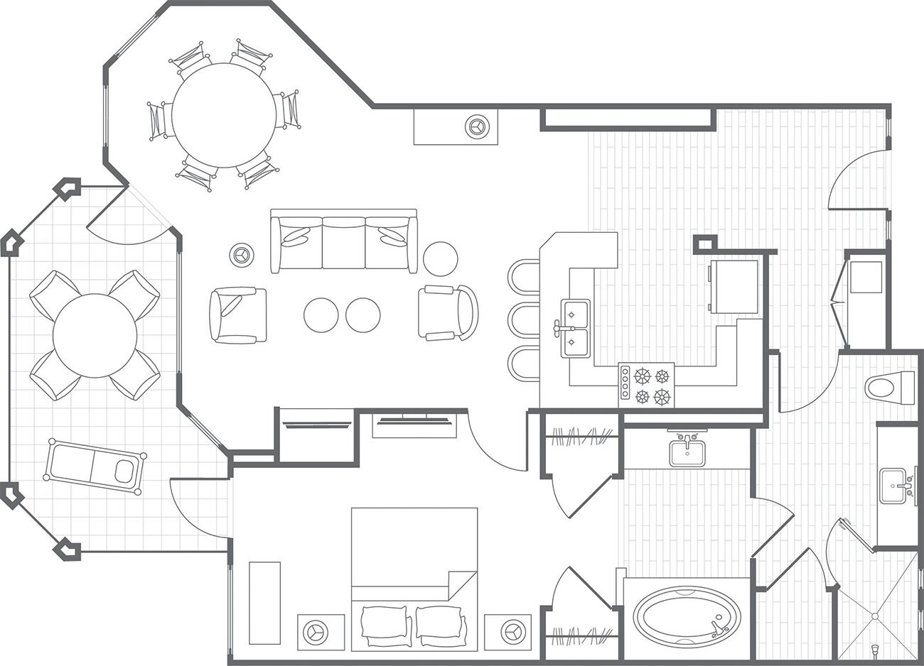 Plano de un hotel que muestra un comedor, cocina, sala de estar y un dormitorio.