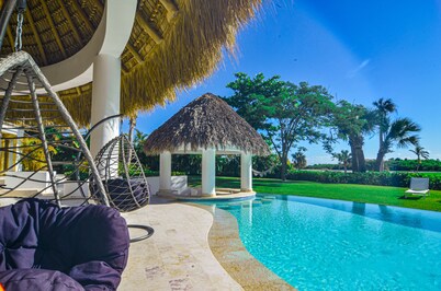 Tropical Golf View Villa. Steps to the ocean with a Gym and Theater-game room.