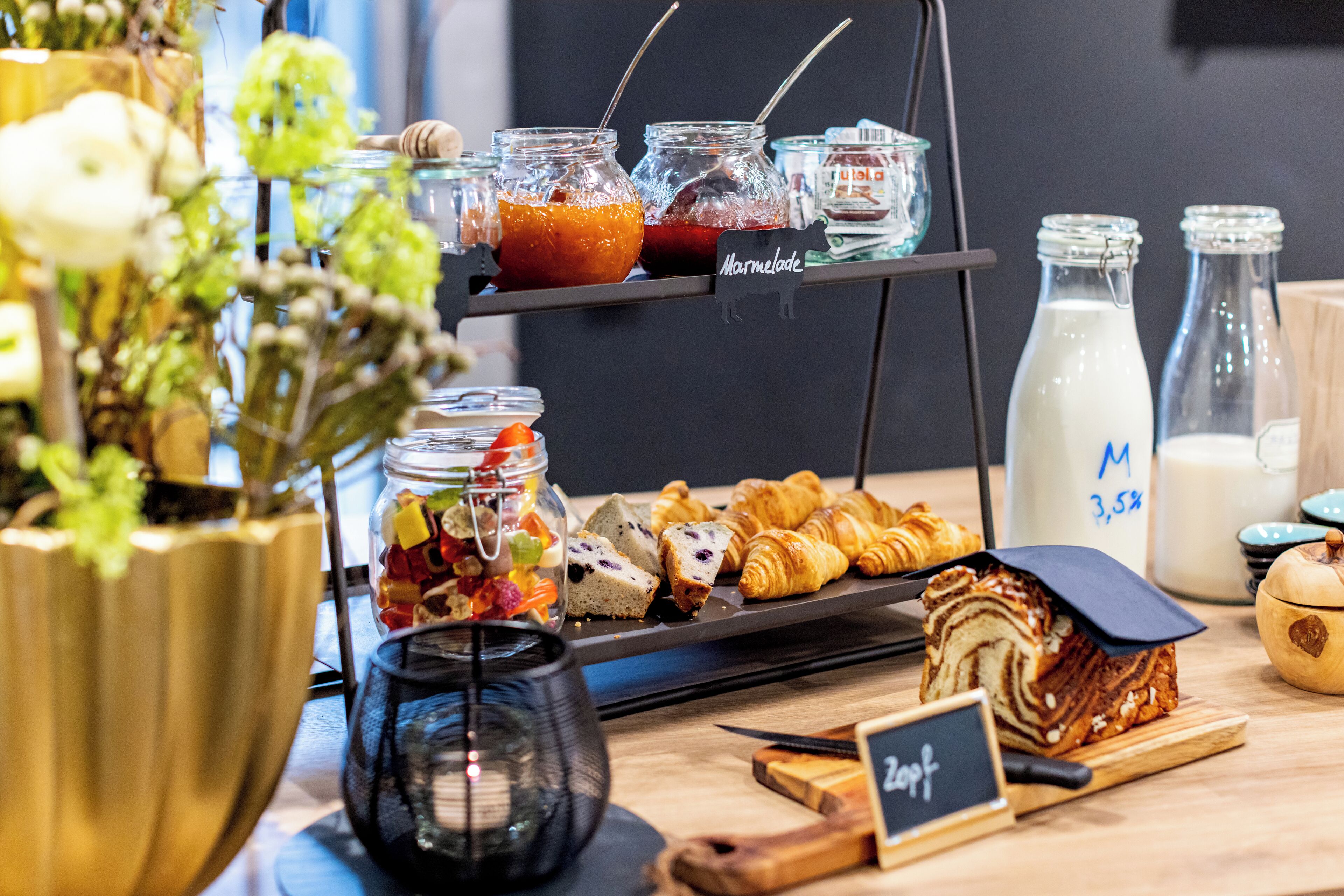 A breakfast buffet with various food items and beverages.