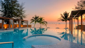 Outdoor pool, open 7:00 AM to 7:00 PM, free pool cabanas, pool umbrellas