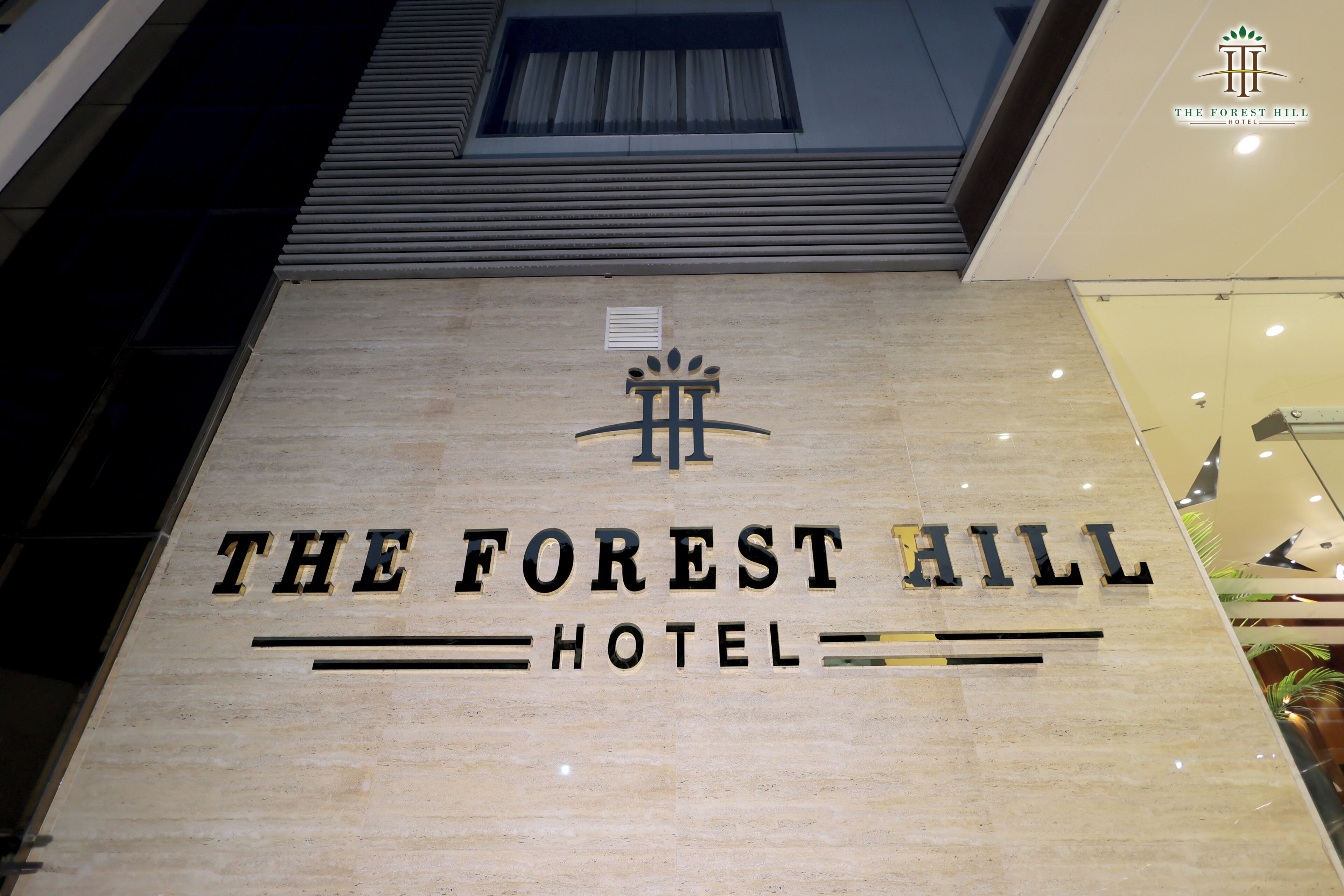 The exterior sign of The Forest Hill Hotel.