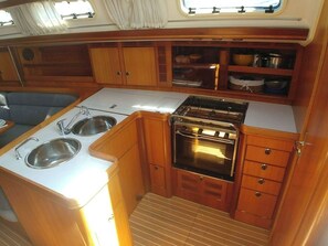 Fridge, stovetop, coffee/tea maker, cookware/dishes/utensils