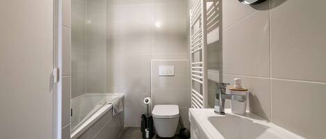 Bathtub, hair dryer, towels