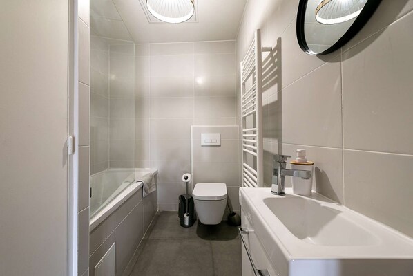Bathtub, hair dryer, towels